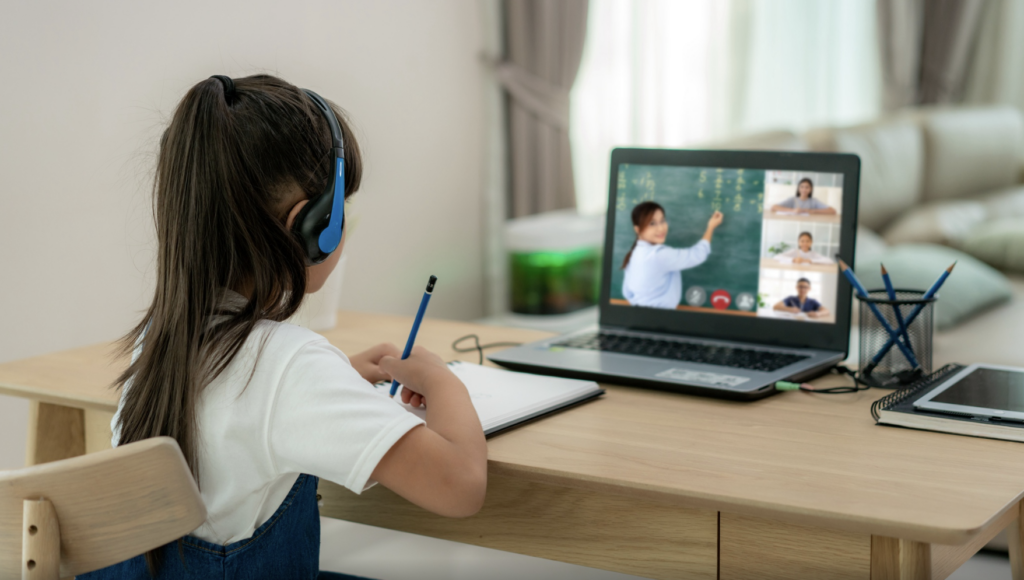 Child learning online with a teacher on screen, representing flexible public school options in North Carolina through STARS Virtual Academy